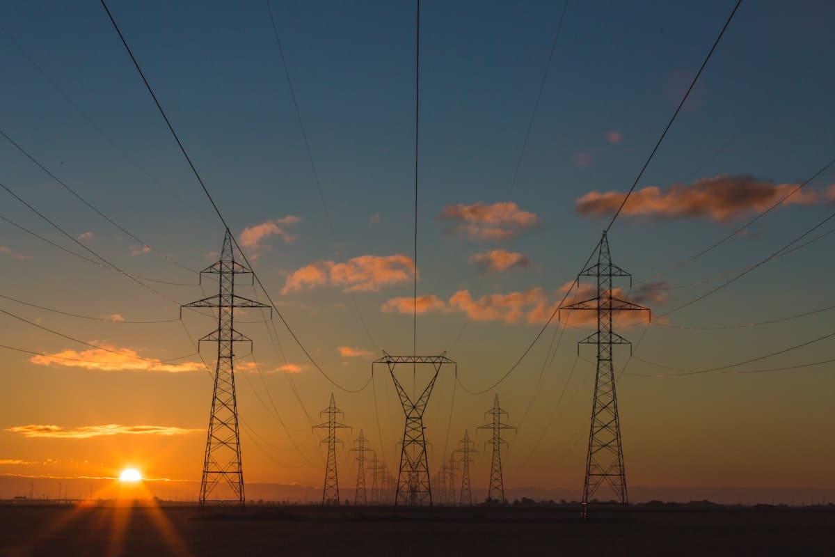 Transmission tower against sky